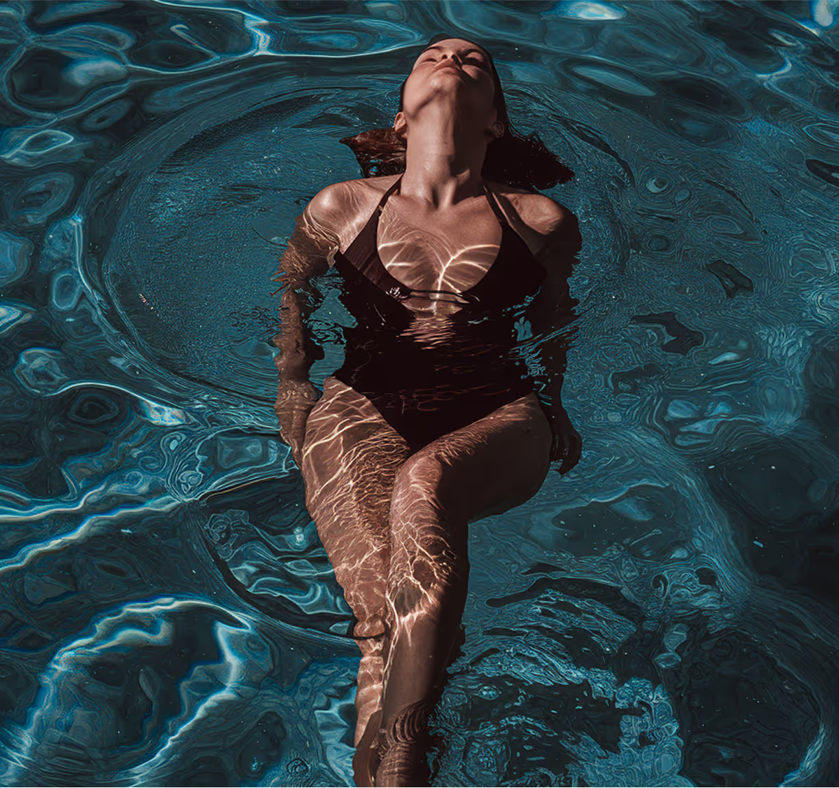 Resident relaxing in the swimming pool at Cascade apartments, London